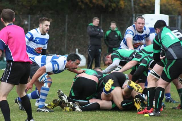 Hastings & Bexhill tussle for possession against New Ash Green. Picture courtesy Karen Walker
