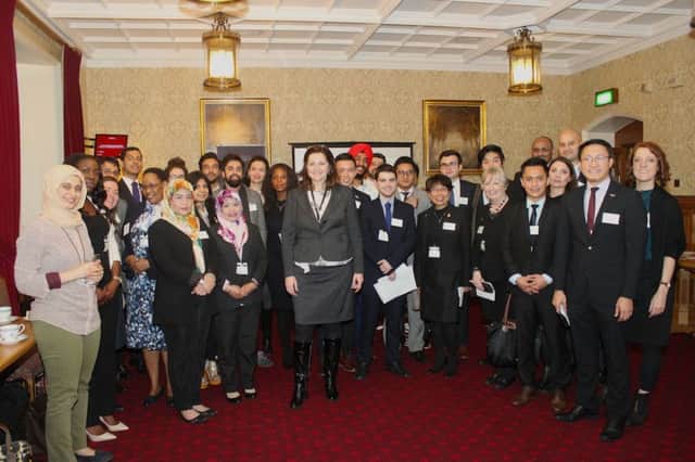 MP Caroline Ansell pictured with young people on International Students' Day