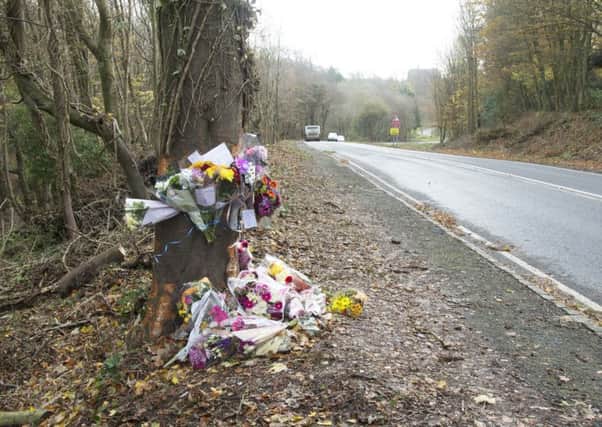 Flowers and messages at the scene of the accident. Photo by Eddie Mitchell.