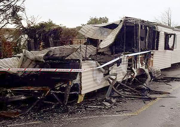 One of the caravans destroyed by a fire at Combe Haven Holiday Park SUS-161122-125313001