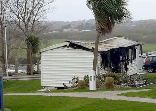 Another caravan damaged by the fire at Combe Haven Holiday Park SUS-161122-125259001