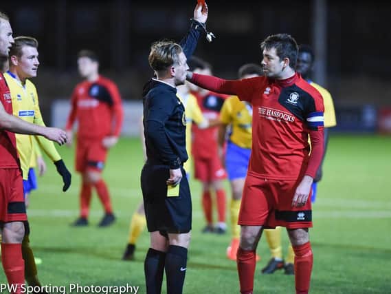 Ashley Marsh, in his 499th match for Hassocks, is shown a red card. Picture by PW Sporting Photography