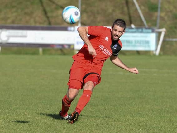 Ashley Marsh in action for Hassocks. Picture by PW Sporting Photography
