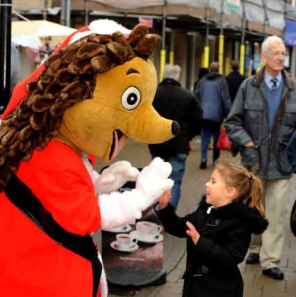Littlehampton Carnival's Christmas Fun Day last year. Hampton the Hedgehog greets visitors