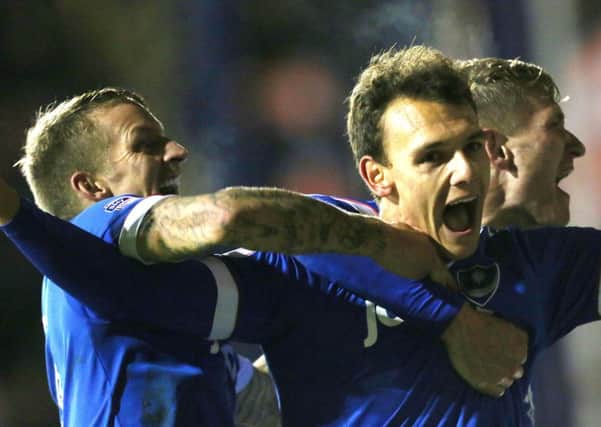 Kal Naismith is mobbed after scoring Pompey's third goal against Luton. Picture: Joe Pepler