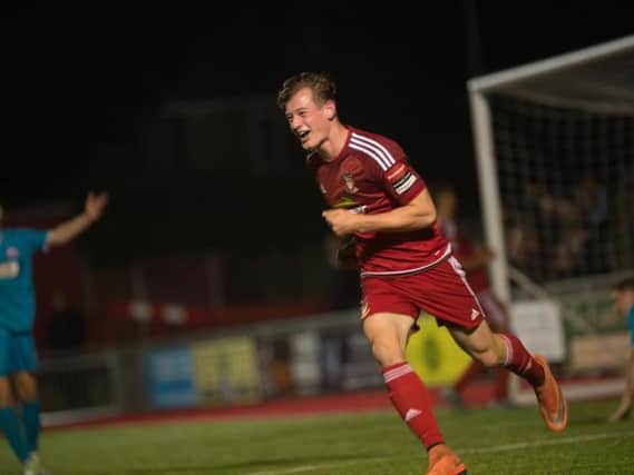 Reece Hallard celebrates scoring against Arundel in the Sussex Senior Cup. Picture by Marcus Hoare