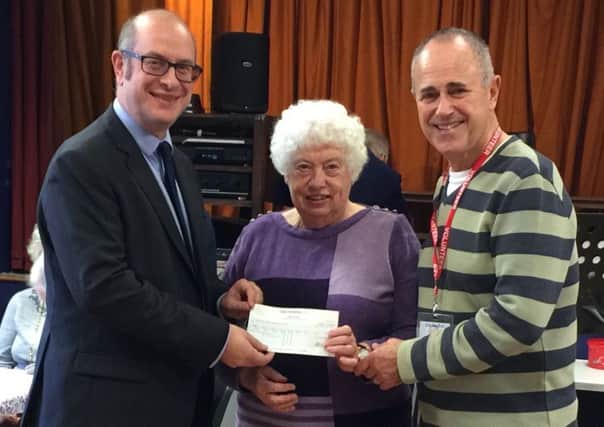 Gaby Hardwicke Partner Richard Ostle (left) presents a cheque for ?1,000 to representatives of the Marsham Older People's Project. SUS-161129-141954001
