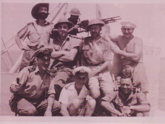 Basil Dick (back row on the left, wearing a false beard) with ship mates in Burma