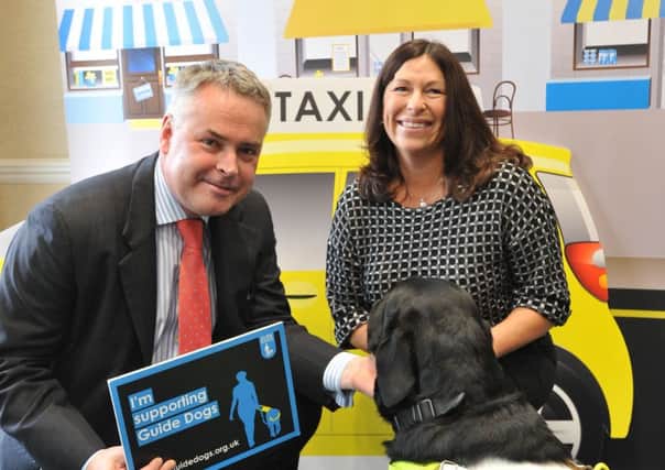 MP Tim Loughton visited a Guide Dogs event in Parliament on 16th November to show his support for taxi and minicab drivers receiving disability equality training when getting their licence. SUS-161125-114849001