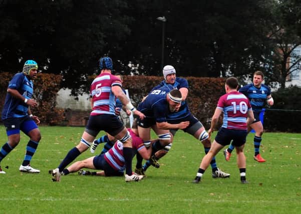 Aaron Davies with the ball for Chichester against Wimbledon / Picture by Kate Shemilt