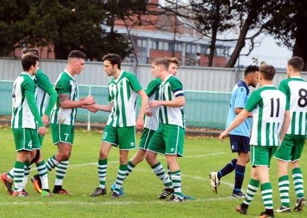 Chichester City players celebrate a goal in the 6-1 beating of Hailsham / Picture by Kate Shemilt
