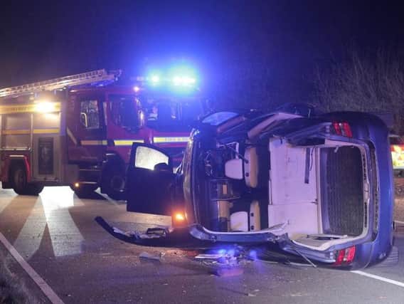 Emergency services were called to a two-car collision near Uckfield on Sunday night. Photos by Nick Fontana.