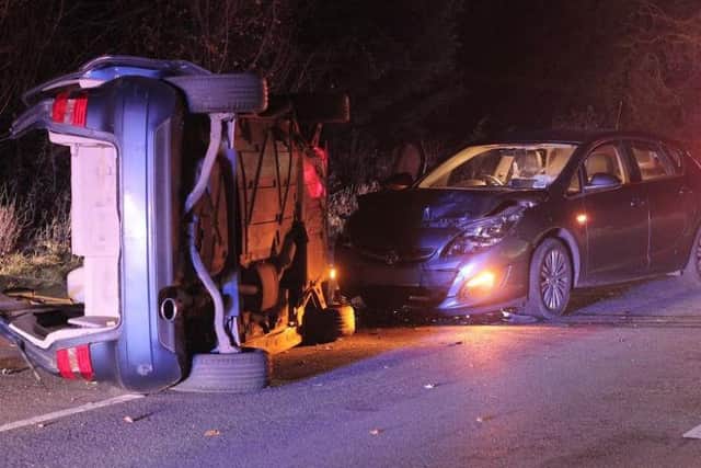 Two people were cut free from an overturned car near Uckfield last night (Sunday). Photo by Nick Fontana.