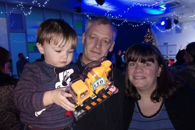 Katherine and Terry Lock from Felpham with their son James, two at the Wickbourne Community Centre Christmas lights switch on event