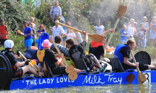 Chris Mole's image of Lewes Raft Race is the July image of the Evonprint's Love Sussex 2017 calendar