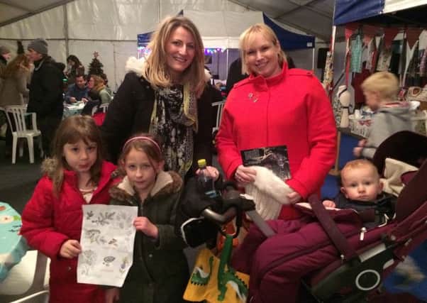 Joanna King and Robyn Payne with Ellie King and Isla Payne, both six, and one year old Callum at the Christmas Artisan Fayre
