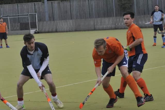 Alex Coombs tussles for possession during Saxons' 6-5 victory. Picture by Simon Newstead