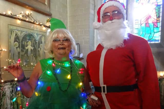 Yo, ho, ho Santa and one of his elves at the Sara Lee Trust Christmas Fair SUS-161129-133049001