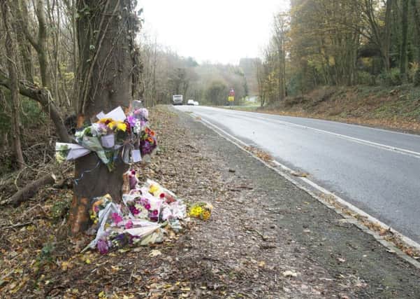 Flowers and messages at the scene of the accident. Photo by Eddie Mitchell