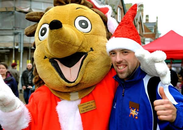 Littlehampton Carnival's Christmas Fun Day in 2015. Nathan Mead (chief Marshall) with Hampton the Hedgehog. Pic Steve Robards  SR1527947 SUS-151214-131257001