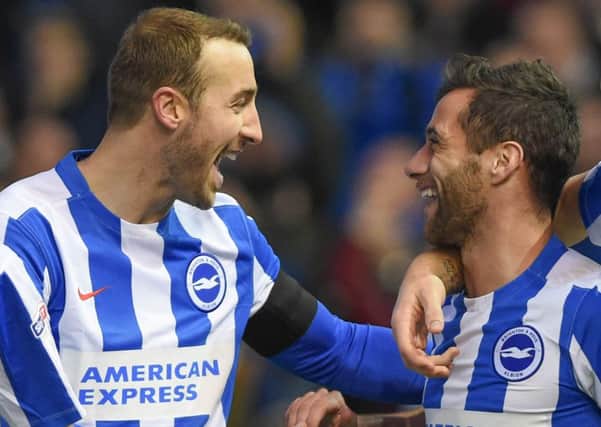 Glenn Murray and Sam Baldock celebrate the latter's equaliser during Albion's win against Fulham on Saturday. Picture by Phil Westlake