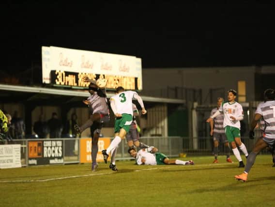 It's handball and the Rocks have a penalty from which they took the lead - Picture by Tim Hale