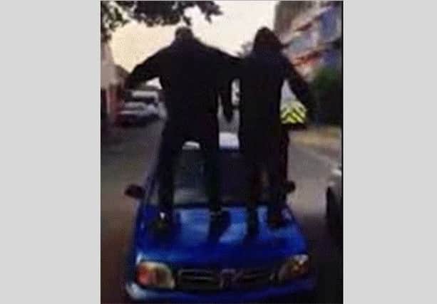 Frame from a police video showing the moment East Grinstead teenagers caused significant damage to a car by jumping up and down on it. Picture: Sussex Police