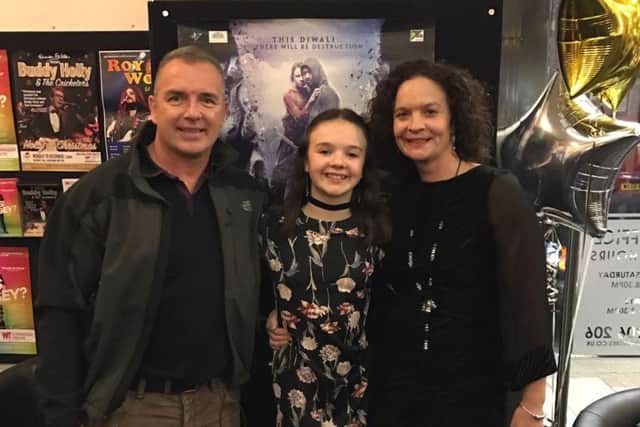 Abigail Eames, 13, with her dad and mum Genienne at the Connaught Theatre