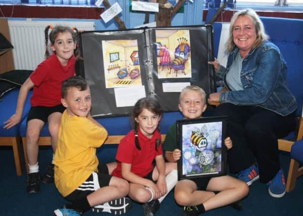 DM16146856a.jpg Local author Sue Hall visits Glebe Primary School, Southwick. Picture with twins Caitlin and Tia Wood, Connor Whitmore and Travis Sydney (right), all aged 7. Photo by Derek Martin SUS-160510-163734008
