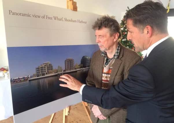Southern Housing representative Spencer Neal, right, shows the latest plans to the Shoreham Society's Gerry Thompson SUS-160712-090435001