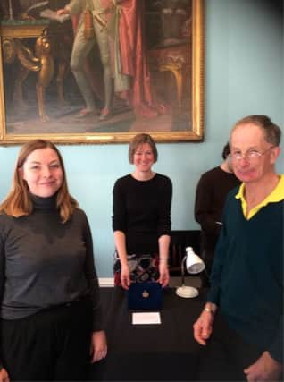 Kathleen Lawther, curator of Littlehampton Museum, Helen Geake, Early Medieval Finds Advisor for the Portable Antiquities Scheme, and Tyndall Jones from Littlehampton with the 7th century escutcheon he discovered. Pictured at the British Museum in London