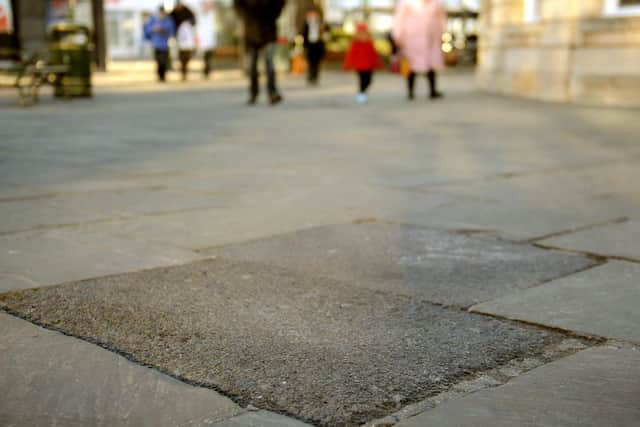 Tarmac has replaced broken paving slabs in the Carfax Horsham. Pic Steve Robards  SR1634870 SUS-161130-153033001