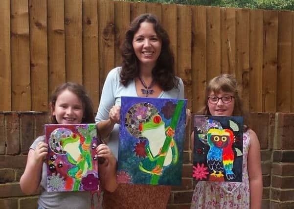 Children's illustrator Corrina Holyoake with the results of one of her Artypeace workshops