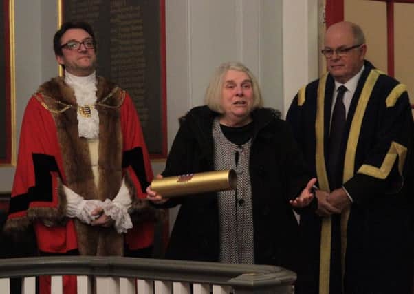 Ann 'Lesley' Brownbill with her commemorative scroll after being made an Honourary Freewoman of the Antient Town of Rye with Rye mayor Jonathan Breeds and town sergeant Kevin Barry. Photo by Ray Prewer SUS-160712-110258001