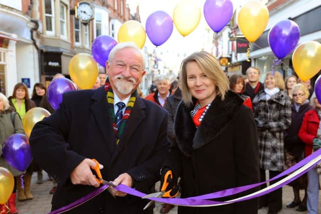 JPCT 161113 Unveiling of changes to Horsham's West Steet and Christmas celebrations. County councillor Brad Watson and Horsham District Councils deputy leader Helena Croft cut the ribbon. Photo by Derek Martin ENGPPP00320131117113819