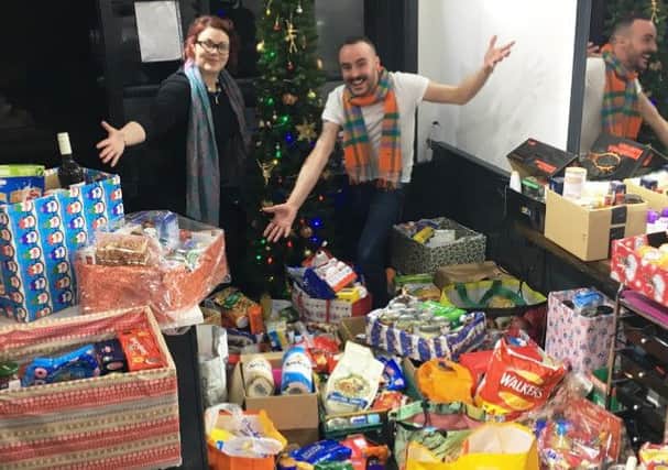 Friends Kate Portlock and Mark Lewis with the reverse advent calendar donations