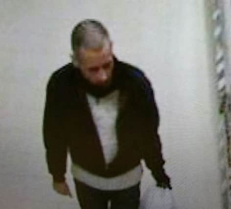 Police are searching for a man in connection with an theft at a supermarket