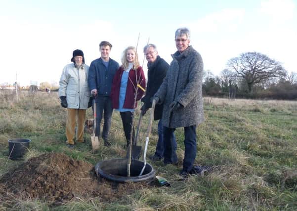 Bill and Louise Jones, right, plant a tree in memory of son Tom, with, from left, Toms grandfather Laurie Vinten, family friend Will Prior and their daughter Kitty Jones