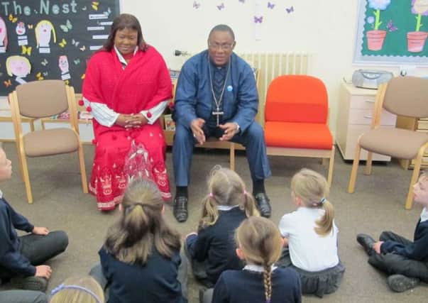 Cameroonian Bishop Dibo and his wife, Mother Estelle with St. Wilfrids Church of England Primary School pupils SUS-160512-102652001