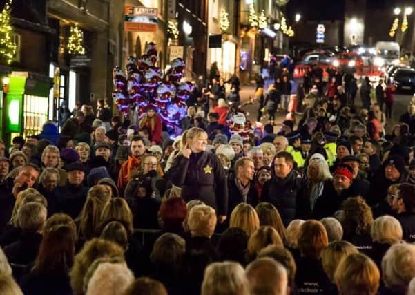 Crowds enjoyed mulled wine and food as they listened to carols and watched the festivities.