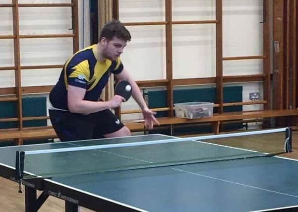 Daniel Pound in action for the table-tennis team