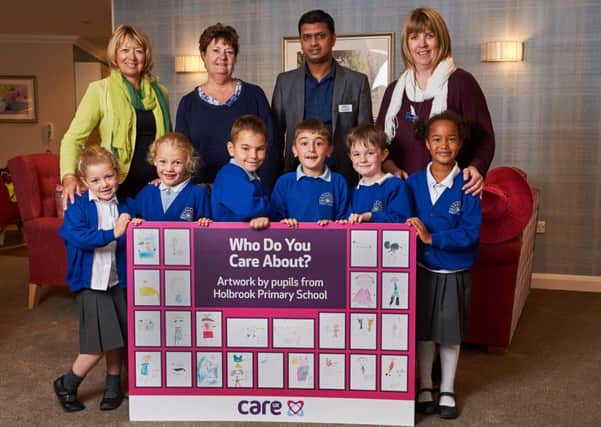 Â© Licensed to simonjacobs.com. 04.10.16 Horsham, UK.
From back left: Karen Davies, Care UK CRM, Sandra Wood, school bursar, Dev Lallchand, home manager and Catherine Taylor, school admin with Year two pupils from Holbrook Primary School with their collection of Who do you care about? drawings at Care UK's Skylark House.
FREE PRESS, EDITORIAL AND PR USAGE.
Photo credit: Simon Jacobs SUS-160512-142352001