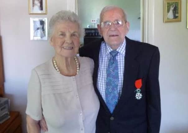Eric Virrels, proudly diplaying his Legion d'Honneur medal, with wife Pat