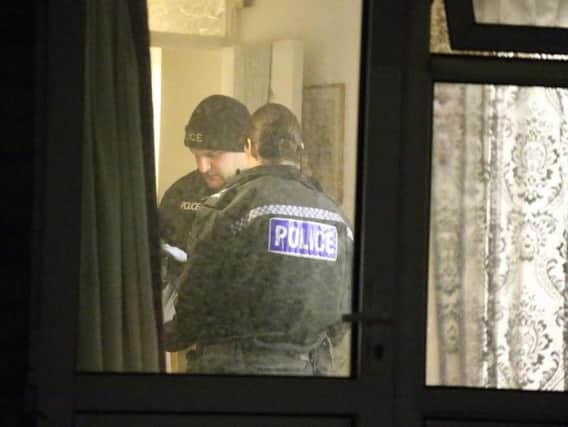 Police search a property in Peacehaven after arresting a man on suspicion of armed robbery. Photo by Eddie Mitchell