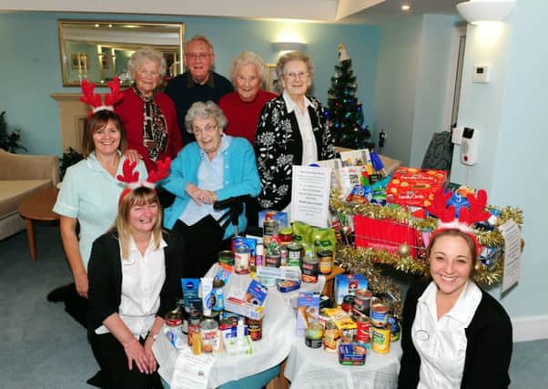 Staff members of Claridge House Leah Bance, Nicki Laker and Alison Bentley with residents Dorothy Teuten, Arne Thelin, Joy Robinson and Edna Collings, who have helped collect items for the Littlehampton Food Bank