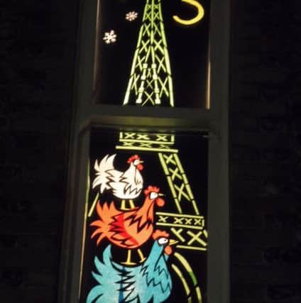 Three French hens at the Eiffel Tower for Advent Window number three