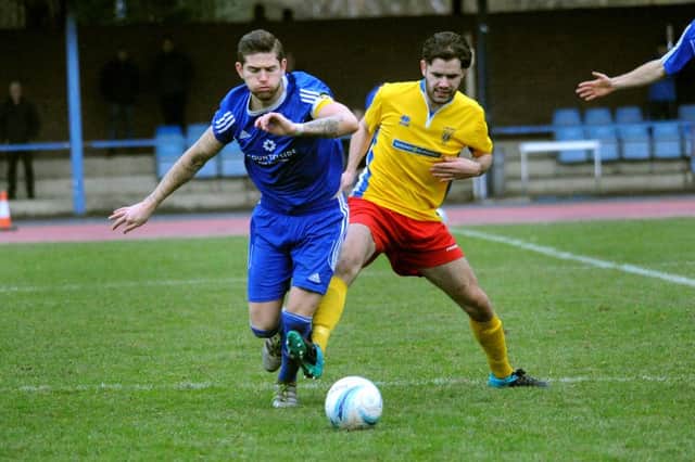 Lancing's Alex Fair tussles for the ball on Saturday. Picture: Steve Robards SR1636180