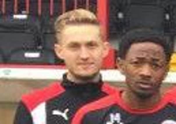 Questions have been raised over this unidentified player in a Crawley Town picture