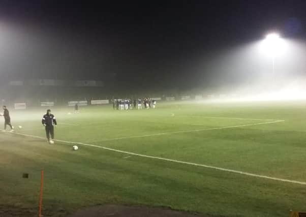 The foggy scene at The Pilot Field shortly before the scheduled kick-off time. Picture by Simon Newstead