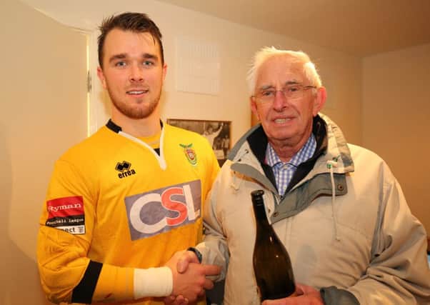 Dan Lincoln picks up his man of the match prize after his penalty save versus Harrow / Picture by Tim Hale